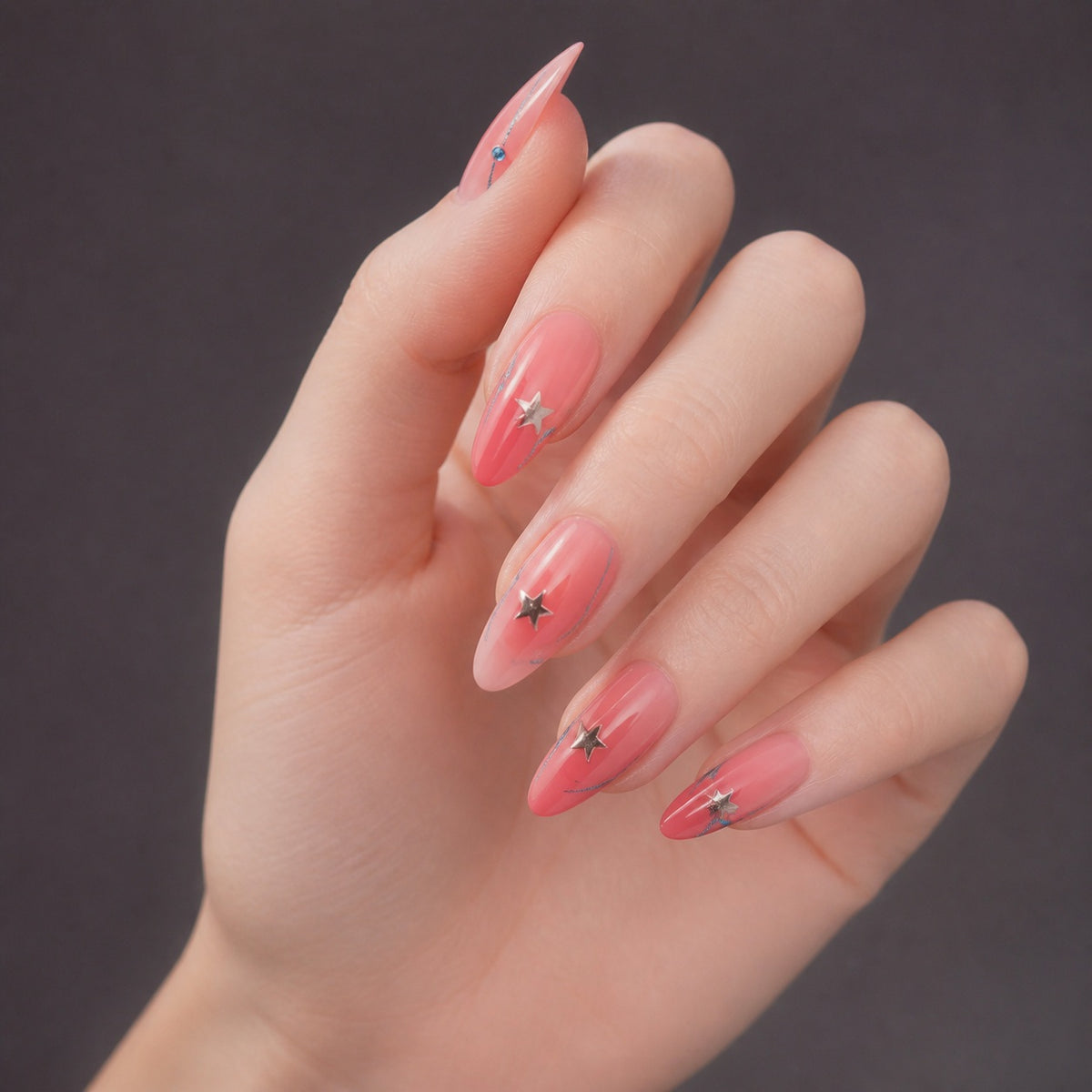 Pink Starline press-on nails on hand