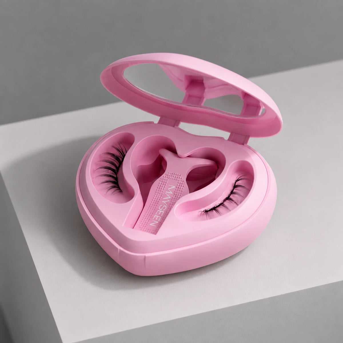Pink heart-shaped magnetic lash compact