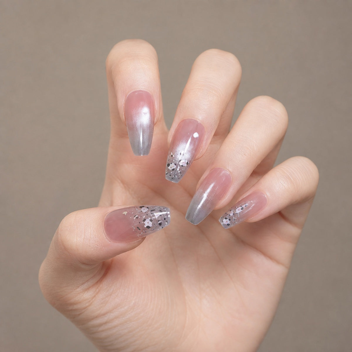 Silver Petal Fade press-on nails on hand