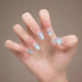 Azure Ribbon press-on nails on hand