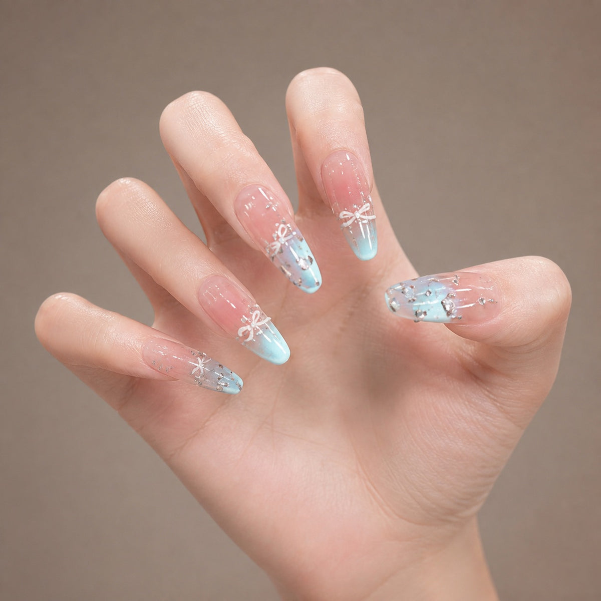 Azure Ribbon press-on nails on hand