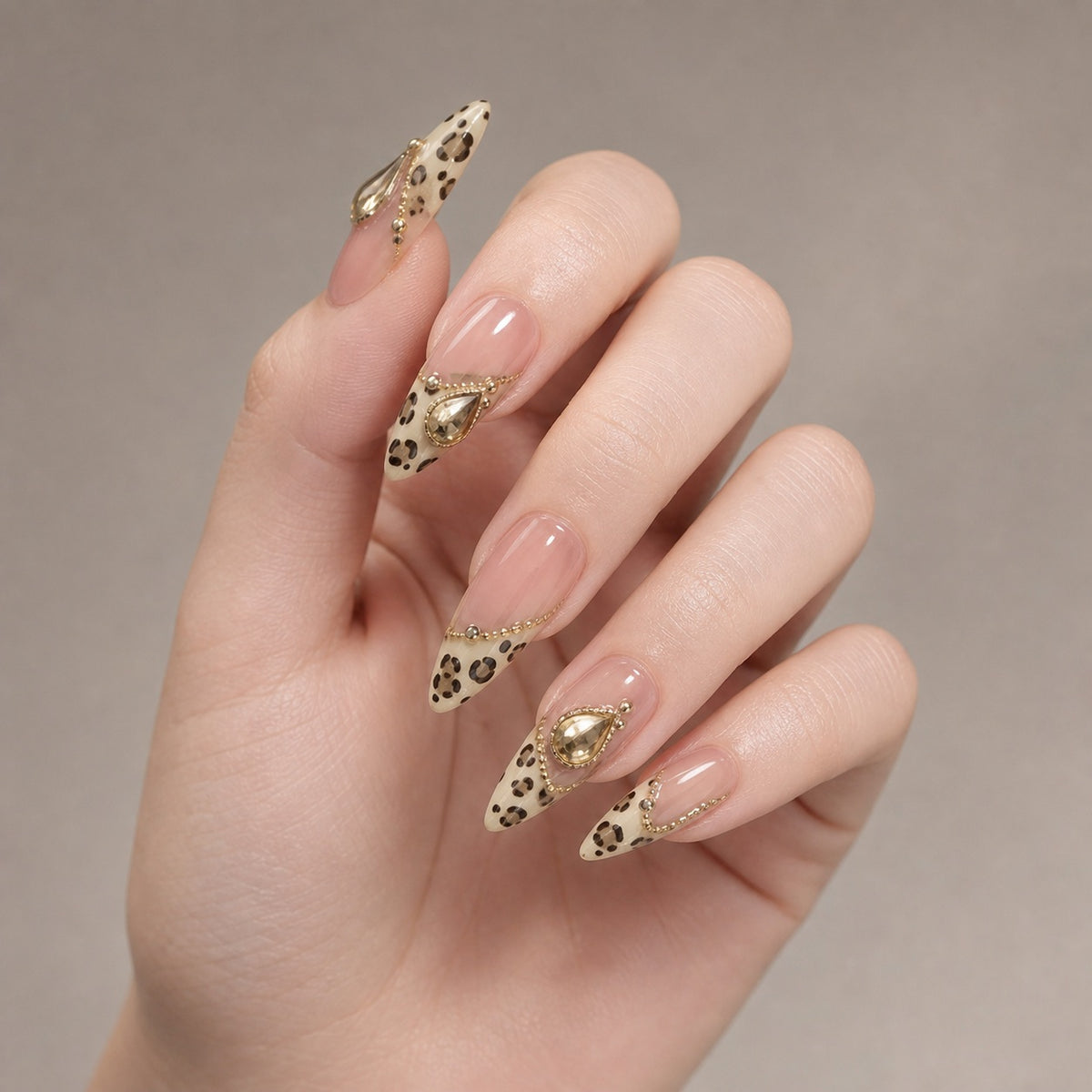 Golden Leopard press-on nails on hand