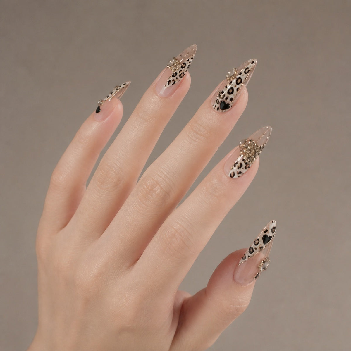 Mocha Leopard press-on nails on hand